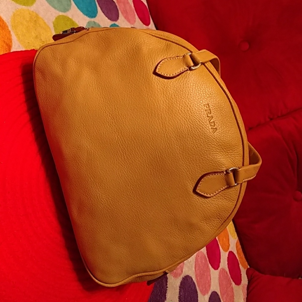 Authentic NWOT Prada yellow soft leather bag.